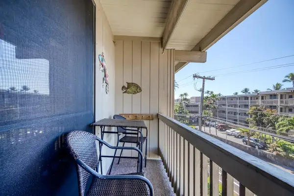 Private balcony space featuring a sturdy safety railing, cozy outdoor chairs, a small table, and open views of the resort complex grounds! 🪑☀️🌴✨