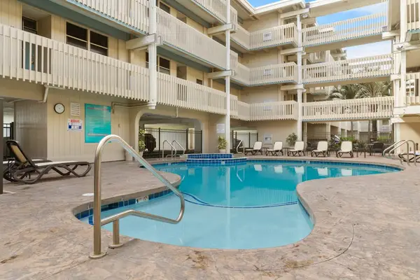 Sparkling resort swimming pool tucked within a beautiful, sunny courtyard complex! ☀️🏊‍♂️🌊