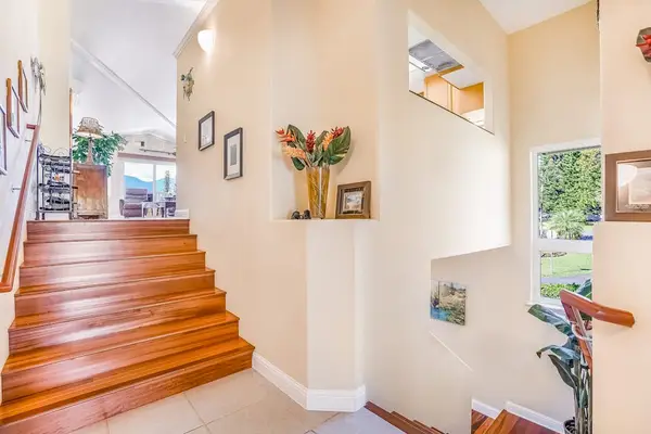 Welcoming Entryway With Open Staircase