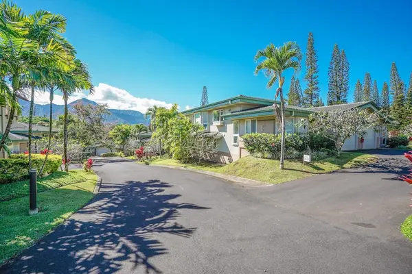 Palm-Lined Property Entrance