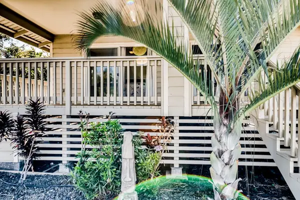 Inviting Front Porch With Tropical Charm