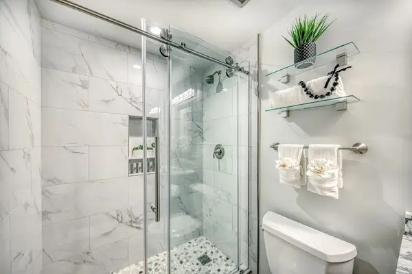 Spacious Walk-In Shower With Marble Details