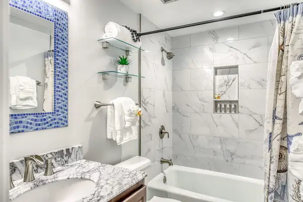 Elegant Full Bathroom With Marble Accents