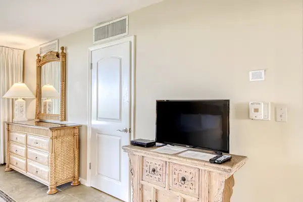 Bedroom With Smart TV And Storage