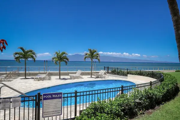 Oceanfront pool featuring a poolside BBQ area.