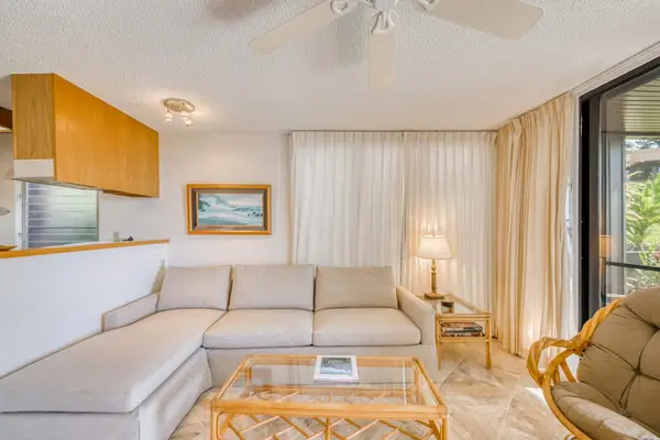 Living room with light from the lanai with a sofa bed for extra company and a flat screen tv.