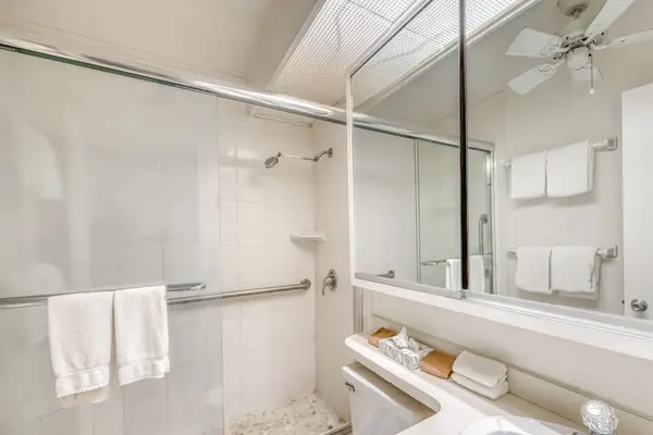 Bathroom with large tiled walk in shower.