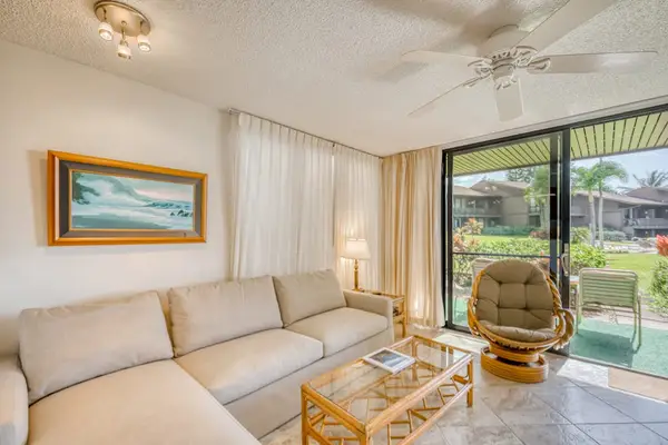 Living room with light from the lanai with a sofa bed for extra company and a flat screen tv.