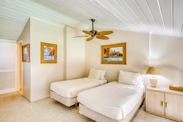 Twin beds located in the loft of the unit.