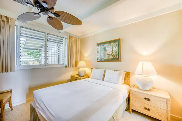 Spacious master bedroom with queen bed.