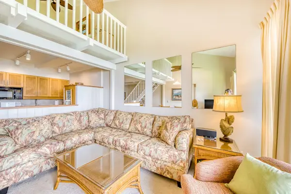 Living room, open to the loft, with a lovely view of the lanai with a flash screen tv and sofa bed for extra company,