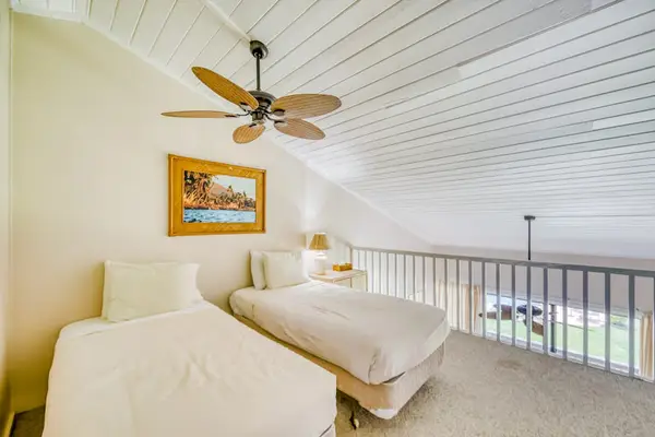 Twin beds located in the loft of the unit.
