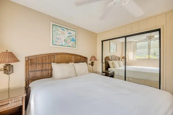 Master bedroom with king bed and a ceiling fan for all night comfort.