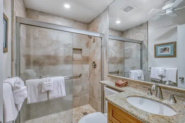 Guest bathroom with walk in tiled shower.
