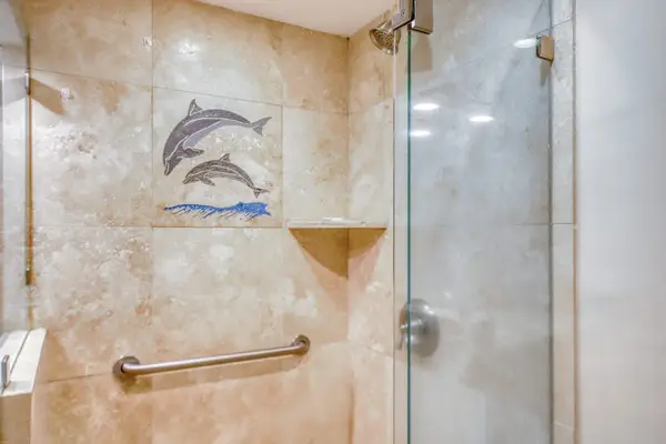 Master bathroom with walk in tiled shower.