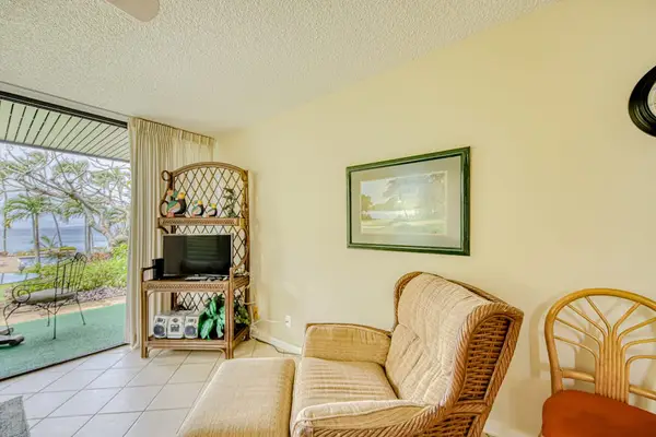 Living room with access to your private lanai and a flat screen tv.