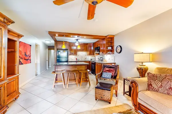Open-concept dining and living area with tropical touches