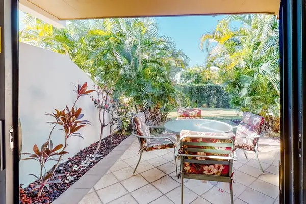 Secluded Patio Surrounded By Tropical Greenery