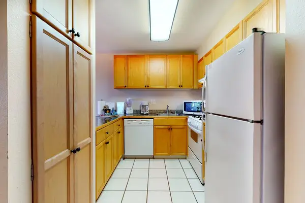 Fully Equipped Kitchen with Ample Cabinetry & Modern Appliances