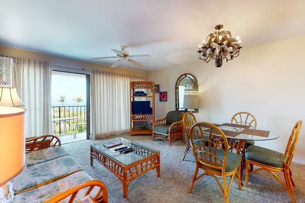 Bright Open-Concept Living Area with Coastal Rattan Decor