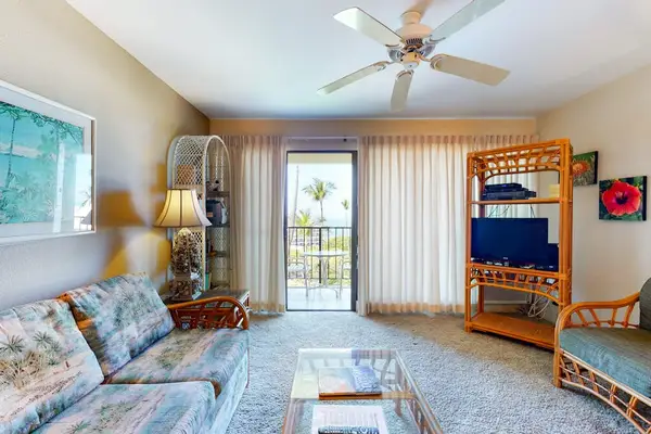 Comfortable Living Room featuring Tropical Views & Patio Access
