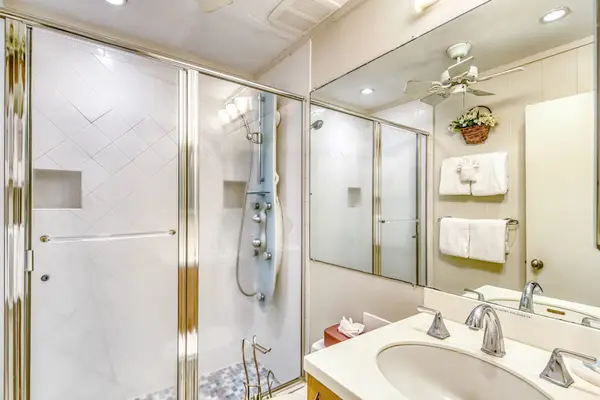 Bathroom with large tiled walk in shower.