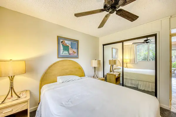 Master bedroom with queen bed and ceiling fan for your evening comfort.