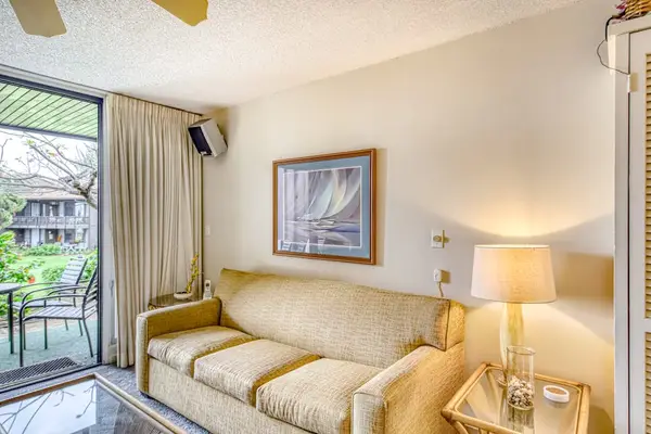Living room leading to the lanai with a sofa bed for extra company.