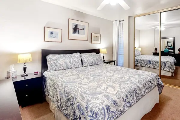 Bedroom with king sized bed and en suite bathroom.