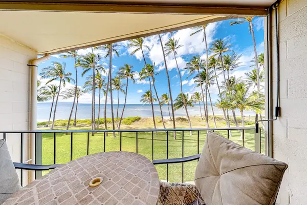 Private lanai with tropical views of palm trees swaying in the breeze.