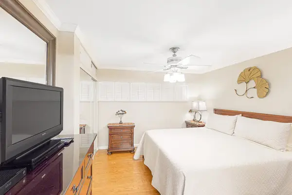 Master bedroom with king bed, en-suite bathroom and a flat screen tv.