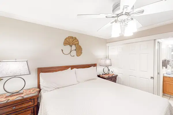 Master bedroom with king bed, en-suite bathroom and a flat screen tv.