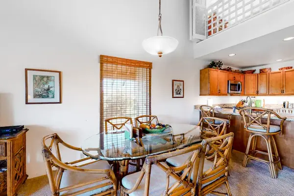 Kitchen counters gleam beside appliances ready for memorable island cooking