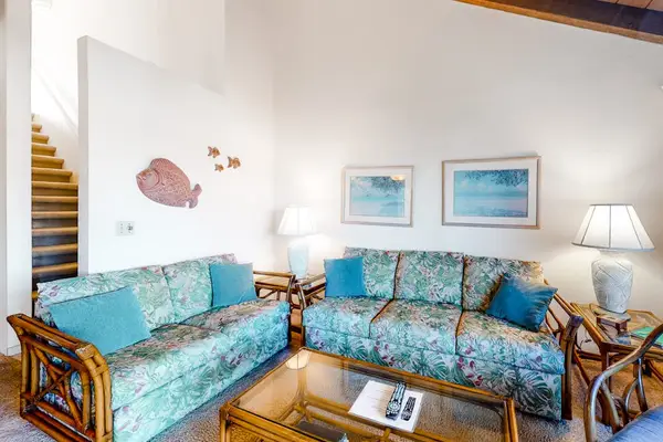 Living room pairs sofas with lamps artwork and coastal accents