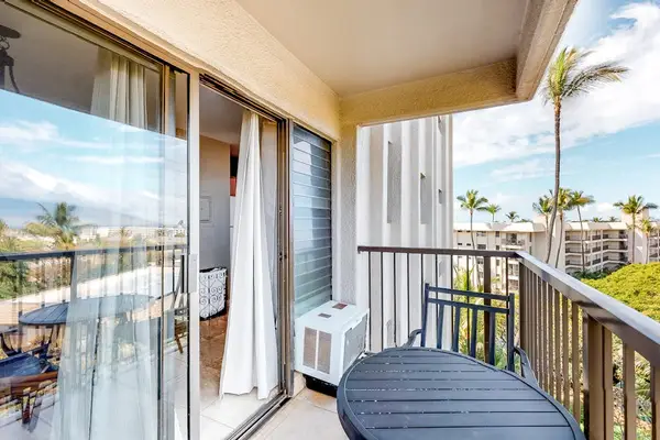 Covered Balcony Area with Outdoor AC Unit and Sliding Glass Entry