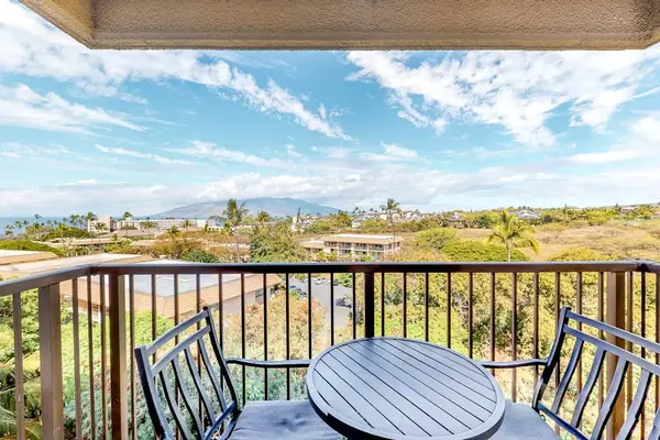 Private Covered Balcony with Outdoor Seating and Scenic Mountain Views