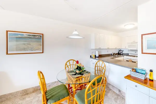Sunlit Dining Nook With Island Charm