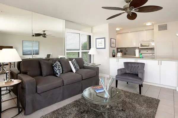 Newly remodeled condo living room with comfortable furniture and a sofa bed for extra guests.