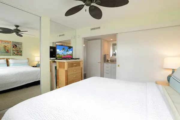 Bedroom with king bed and flatscreen tv.