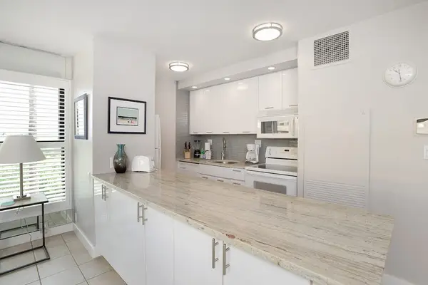 Modern new kitchen with lots of natural light and views in from the outside lanai.