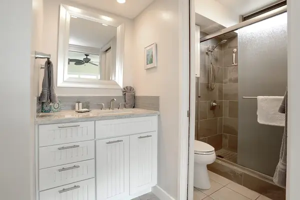 Newly remolded condo with walk in tiled shower.