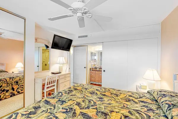 Bedroom with king bed and flat screen tv.
