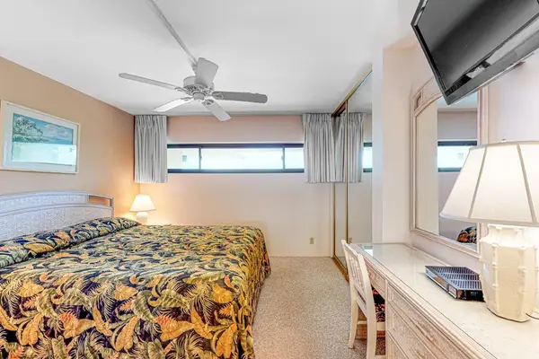 Bedroom with king bed and flat screen tv.