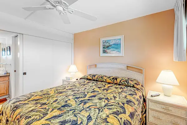 Bedroom with king bed and flat screen tv.