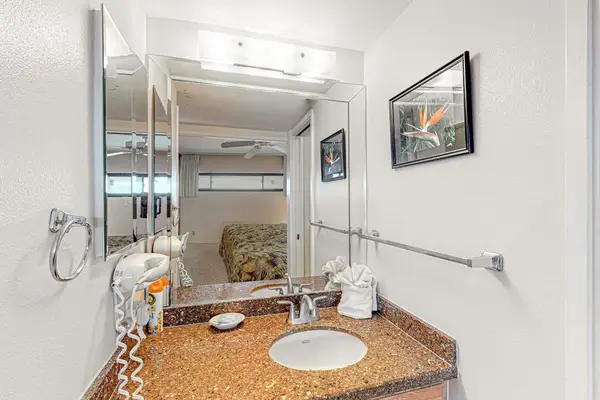 Bright, updated bathroom featuring a spacious tiled walk-in shower and modern finishes.