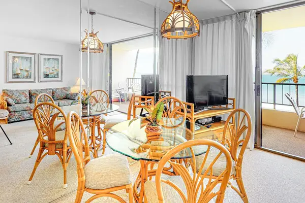 Enjoy meals at the dining table with beautiful views through to the private lanai, bringing the outdoors in.