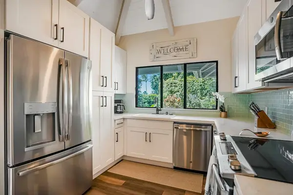 Fully remodeled kitchen with new stainless steel appliances.