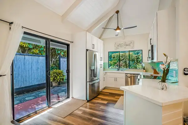 Kitchen with lots of light from the sliding doors leading to the lanai.