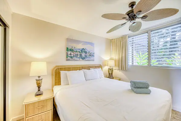 Master bedroom with king bed and ceiling fan to keep you cool.