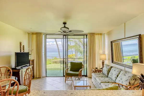 Living room with lanai access and a flat screen tv for evenings when you want to relax.